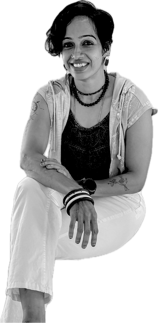 Krishnapriya Satagopan, strength coach, seated and smiling